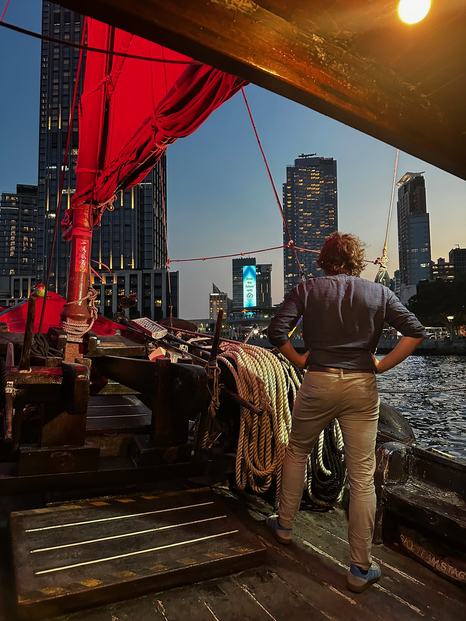 Junk boat sailing at night, Hong Kong